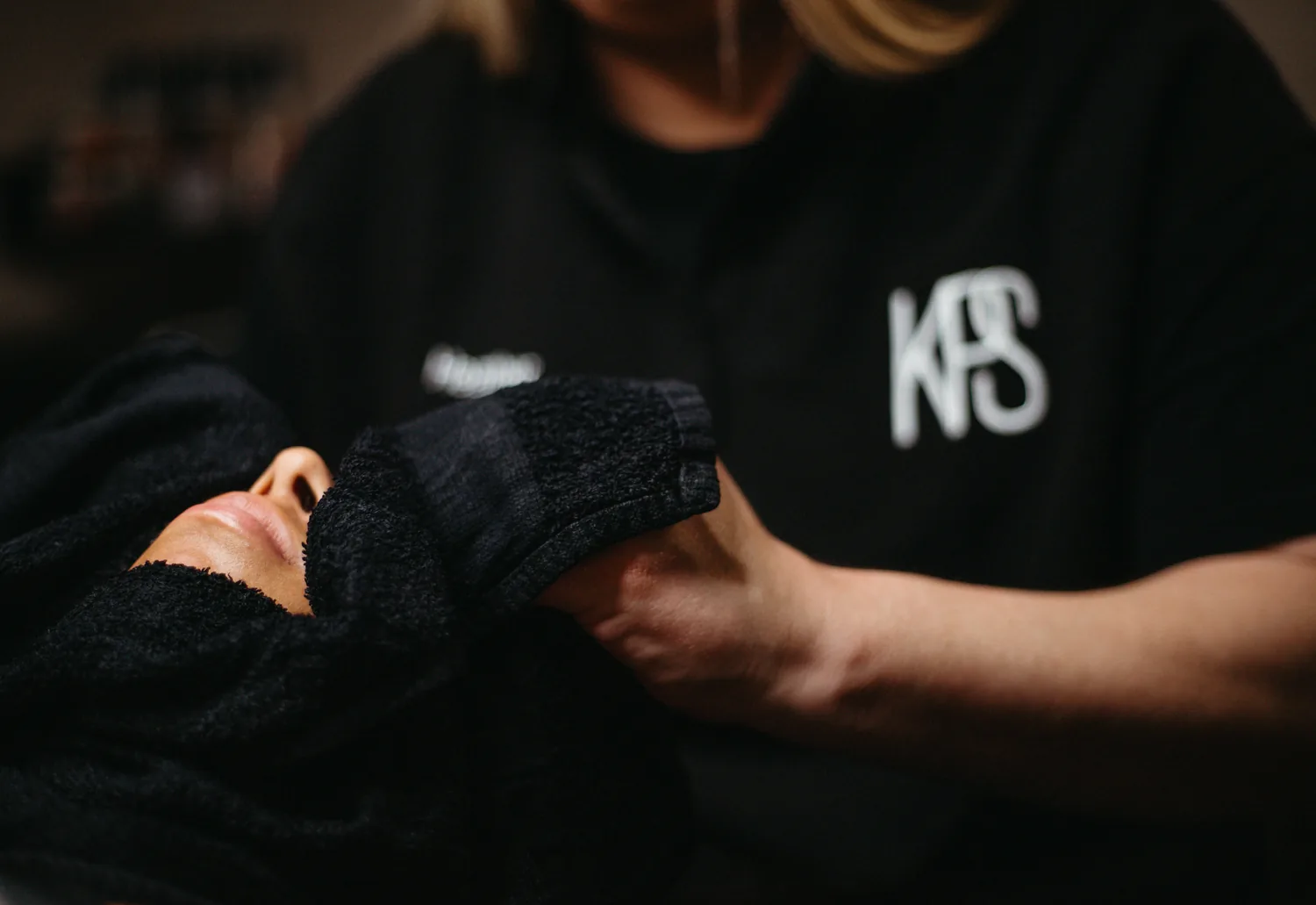 Heather providing hands-on esthetic care during a customized facial at Skin Cove